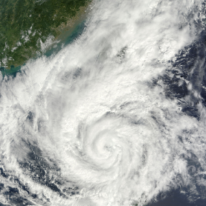 Photo of two hurricanes forming over an ocean